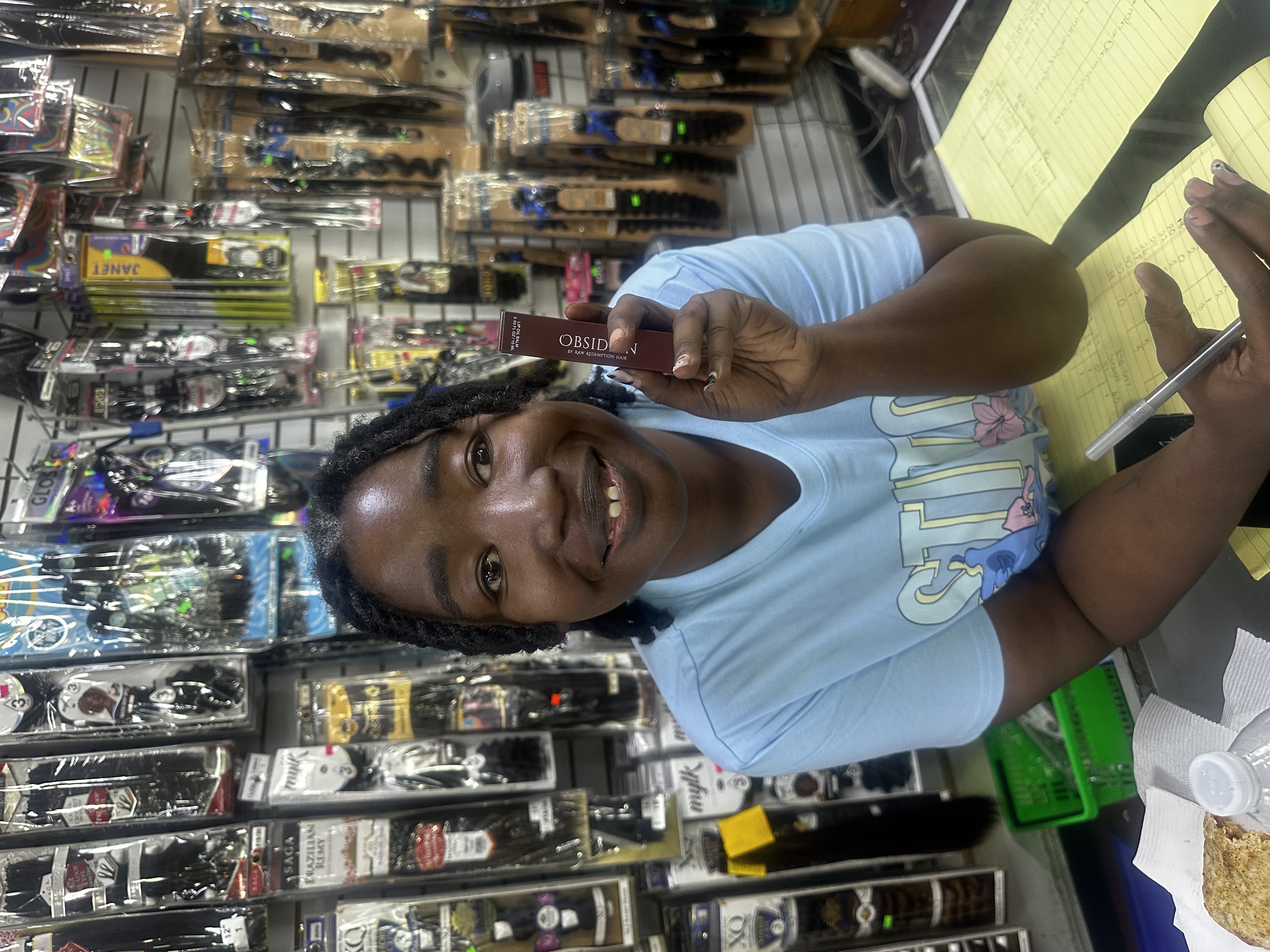 Supporter at beauty supply with Obsidian Lip Oil