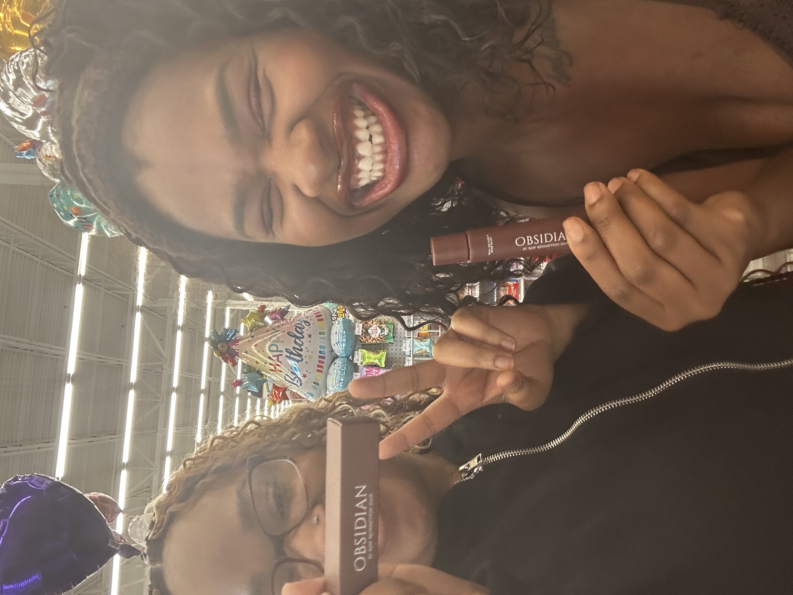 Supporters celebrating with Obsidian Lip Oil